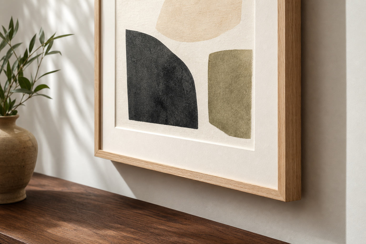 Close-up of framed abstract print with oak frame and mat