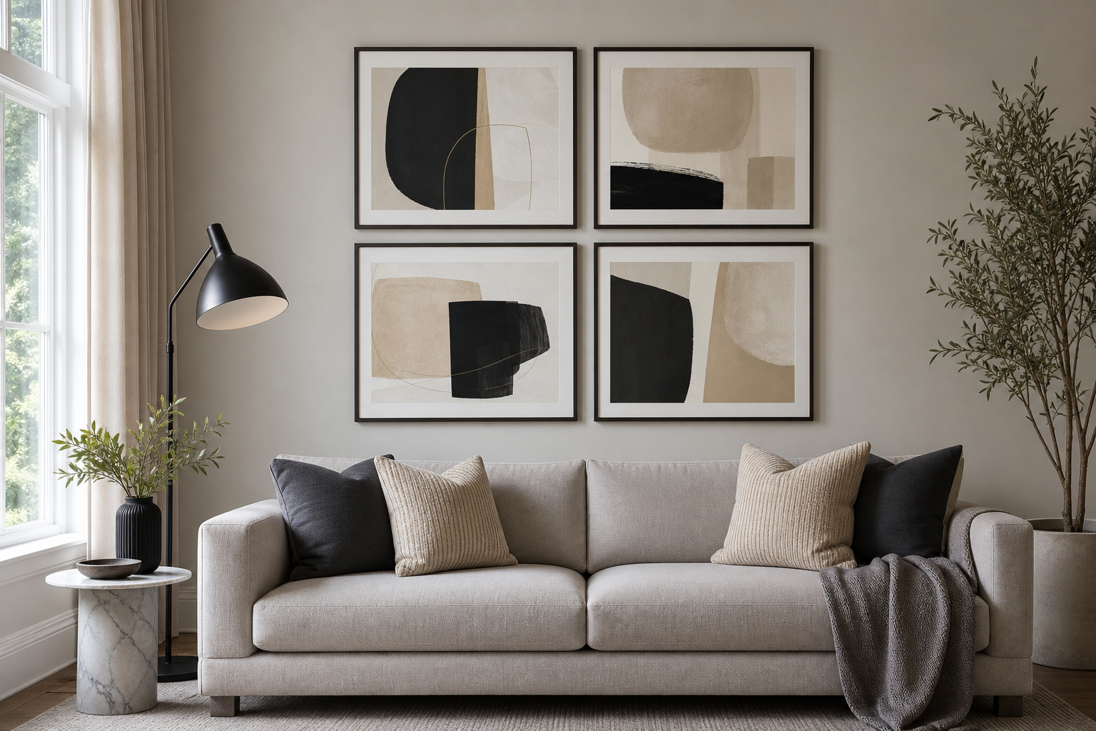 Example gallery wall with abstract prints above a sofa