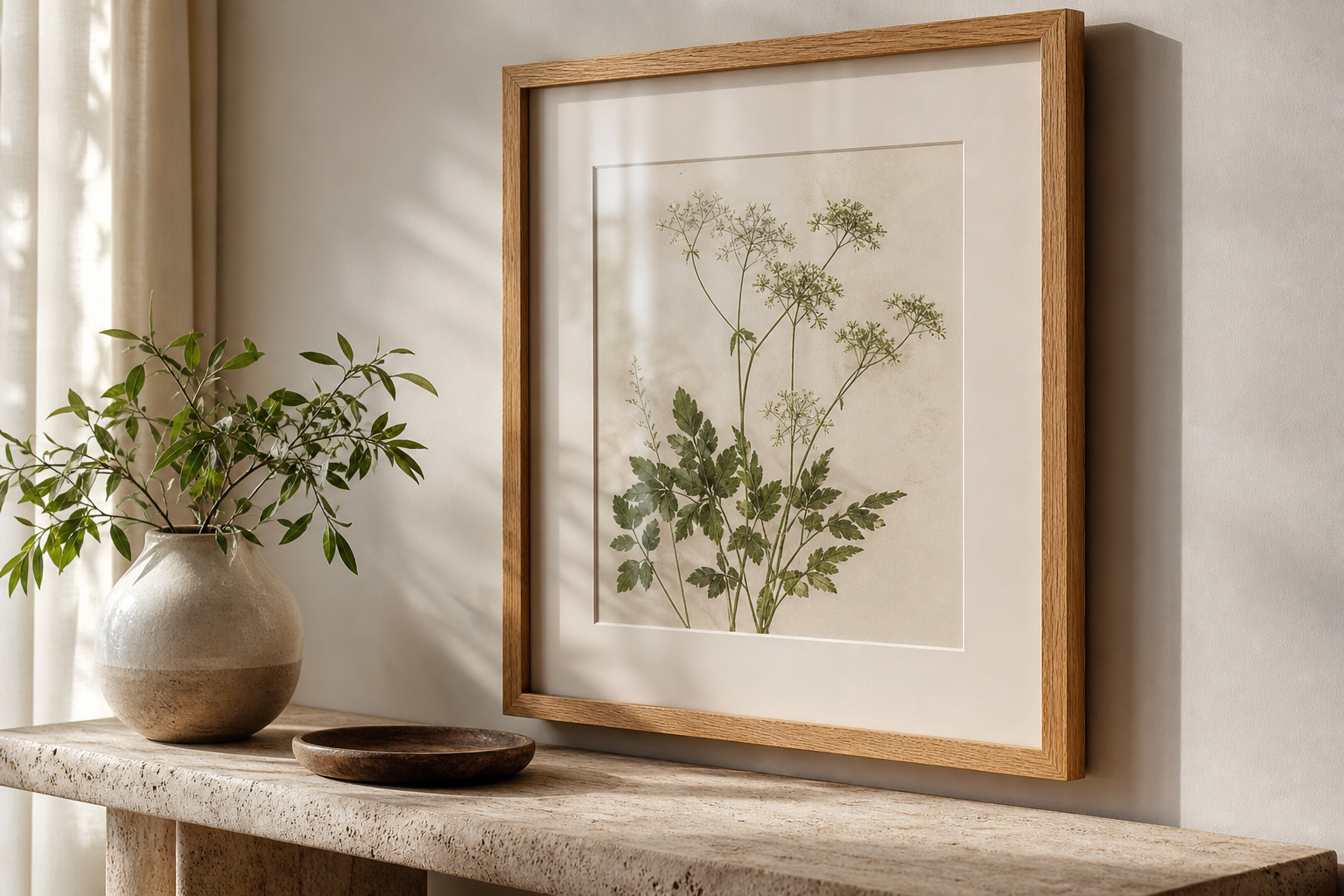 Close-up of framed botanical print with mat and oak frame