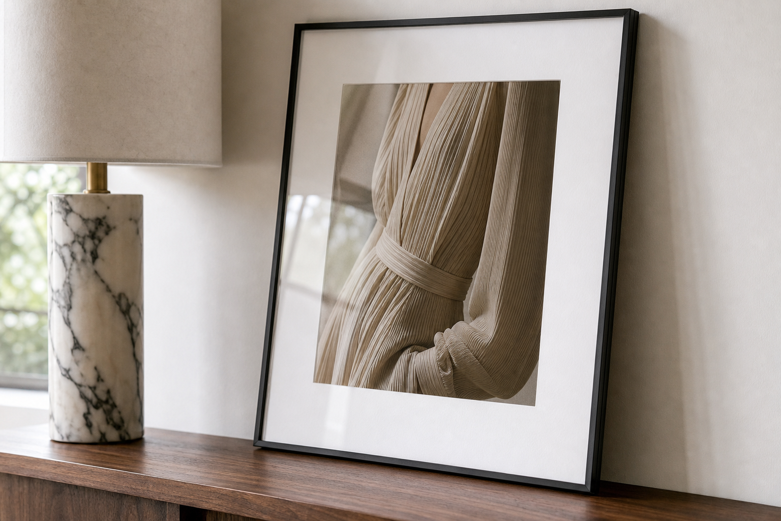 Close-up of framed fashion print and materials