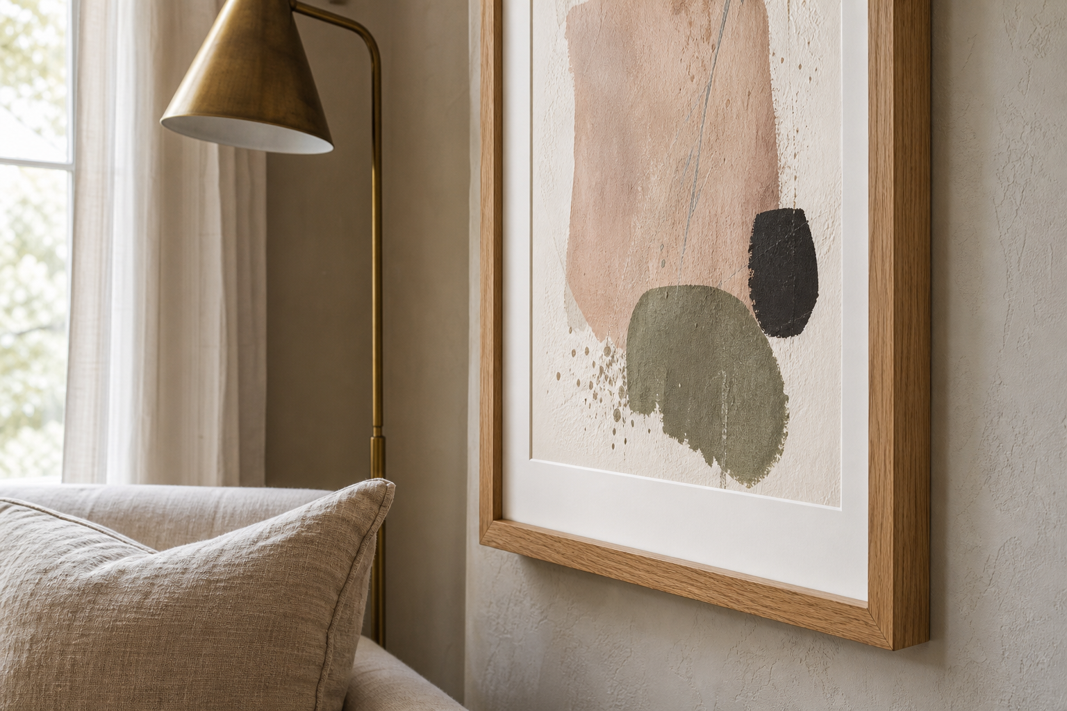 Close-up of wood frame, mount, and textured art finish in a living room