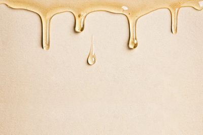 Beige background wallpaper dripping oil.