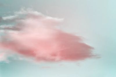 Blue sky soft pink clouds.