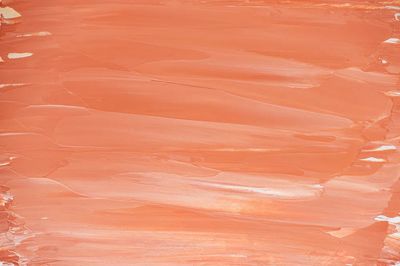 Bright orange brush stroke background. poster