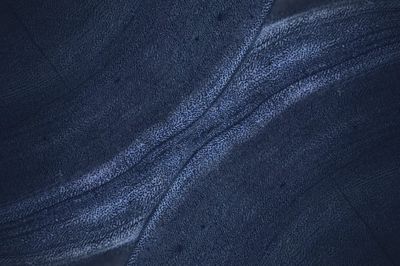 Blue rough concrete wall background.