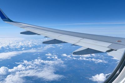 Airplane Wing Above Clouds Photography Poster.