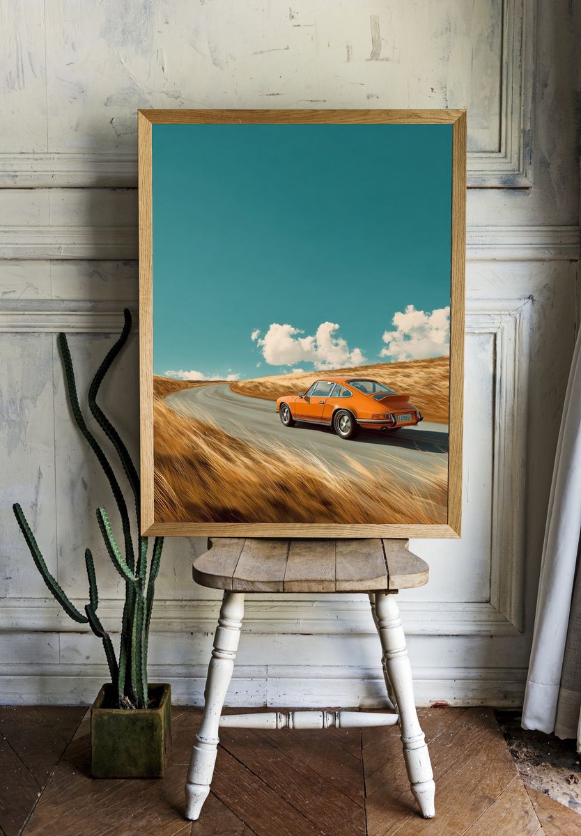 Orange Porsche on Coastal Road Poster. — room view 1
