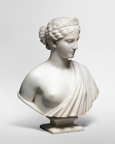 Nude woman sculpture showing America.