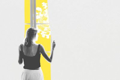Young woman looking window coronavirus.