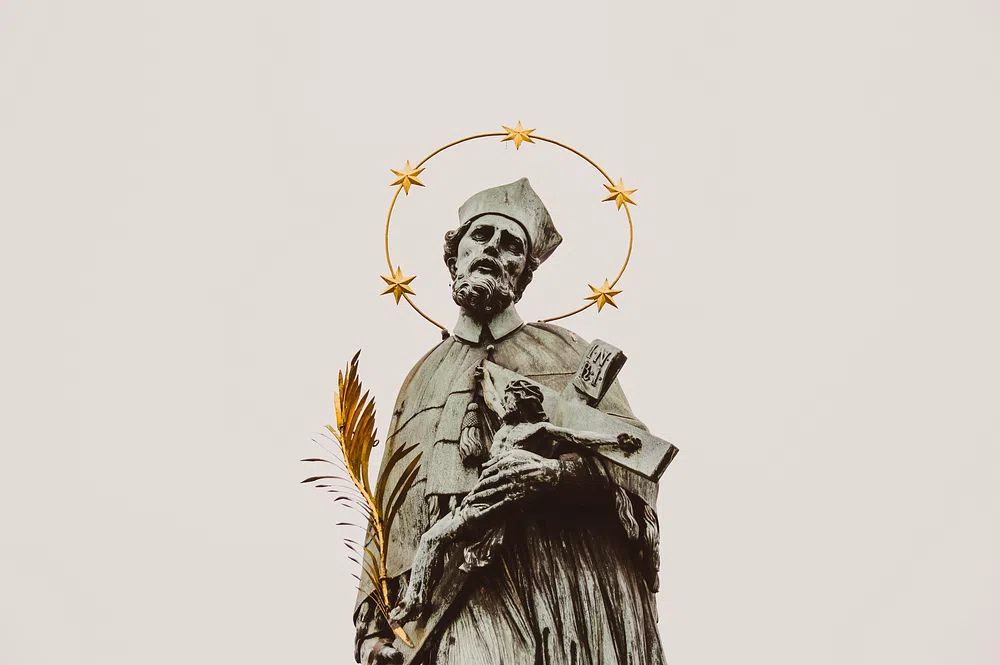 Stone statue saint crucifix gold. poster detail