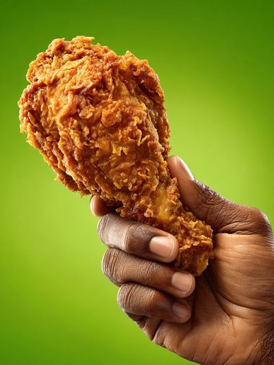 Fried Chicken Handheld Photography Poster. poster