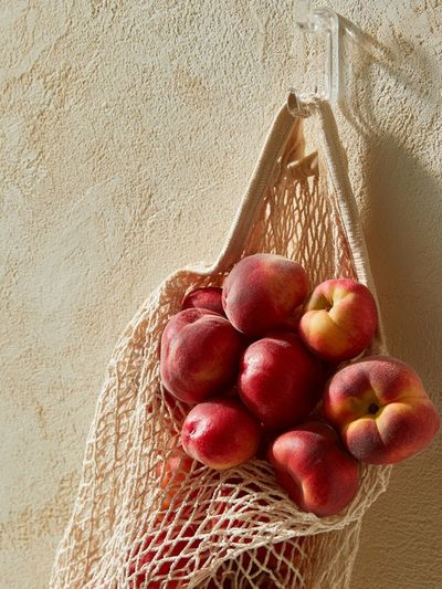 Peaches in Net Bag Photography Poster. poster