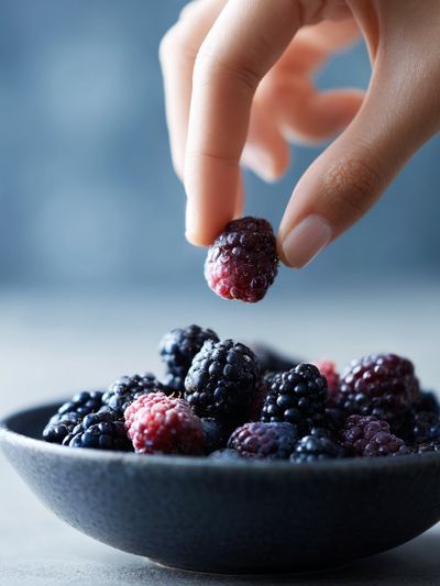 Blackberries in Hand Photography Poster.