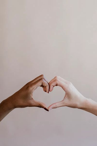 Diverse cute heart shaped hands.