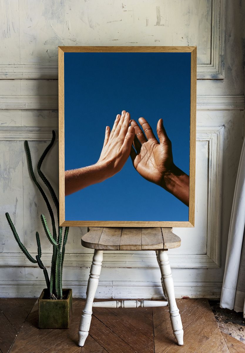 Hands Against Blue Sky Photography Poster. room preview