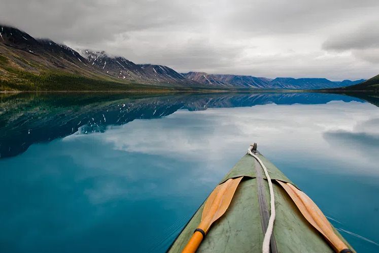 Kayaking on a Serene Lake Poster. poster detail