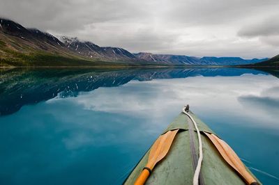 Kayaking on a Serene Lake Poster. poster