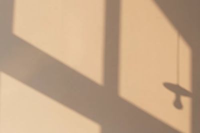 Late afternoon light beige wall.
