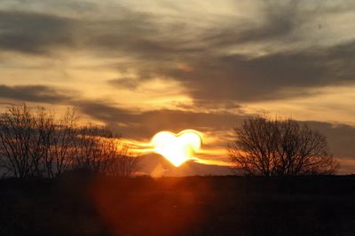Evening background, heart shaped sun. poster