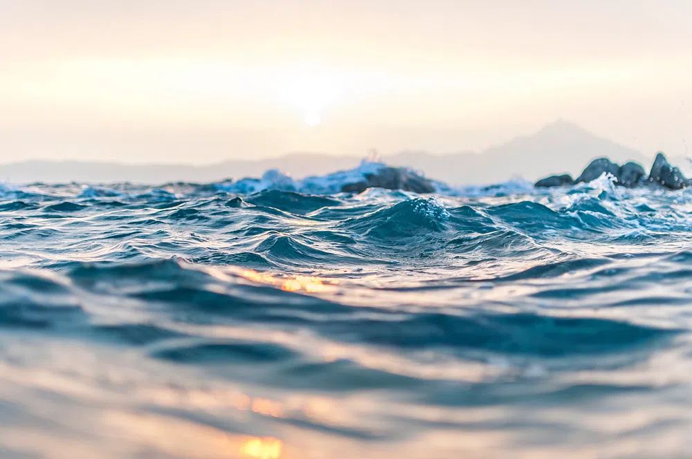 Ocean waves rippling Kavourotrypes Beach. poster — photography art