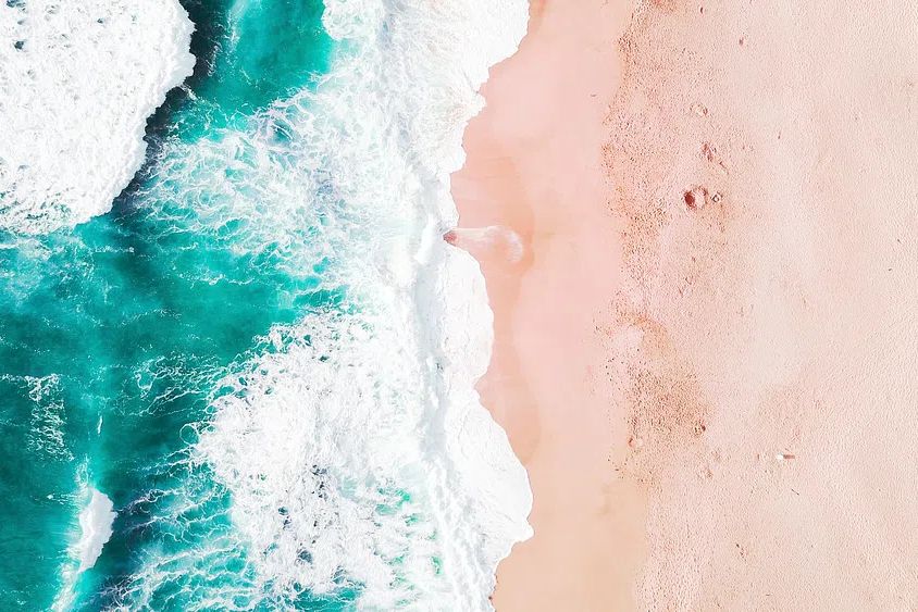 Aerial of Turquoise Ocean and Pink Sand Beach Poster. poster detail