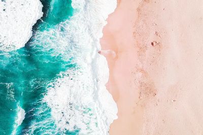 Aerial of Turquoise Ocean and Pink Sand Beach Poster. poster