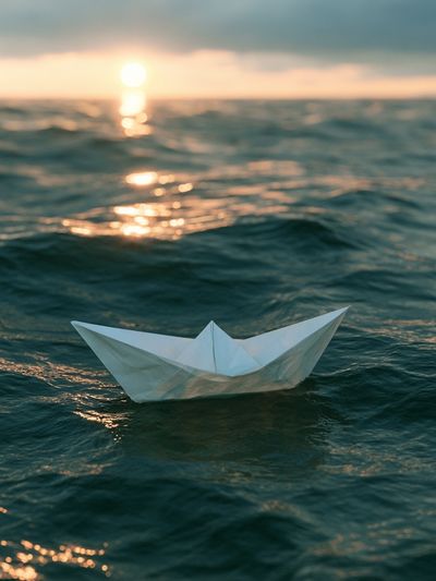 Paper Boat at Sea Photography Poster.
