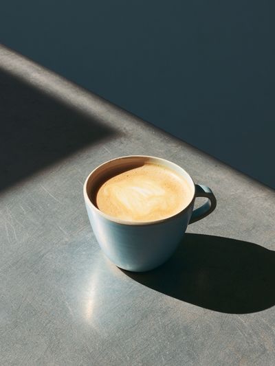 Sunlit Coffee Cup Photography Poster. poster