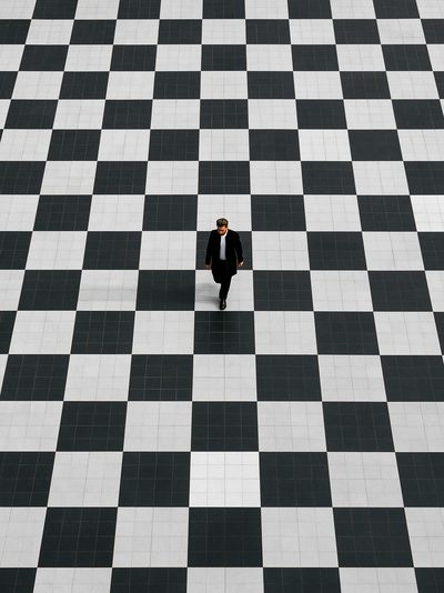 Solitary Walker Checkered Floor Poster.