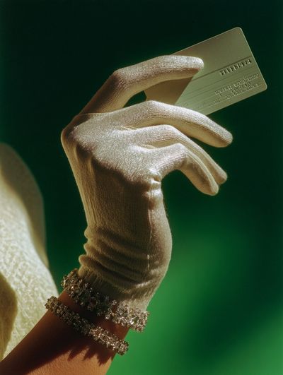Gloved Hand with Credit Card Photography Poster. poster