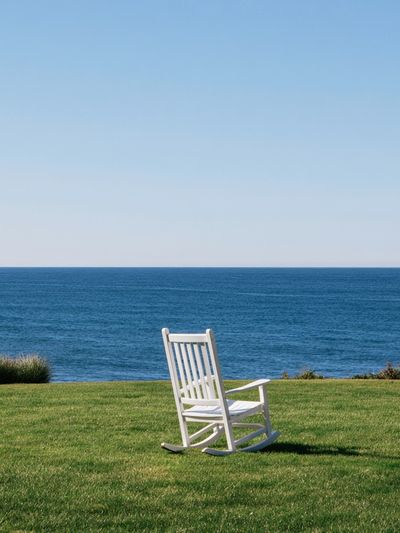 Oceanfront Rocking Chair Photography Poster.