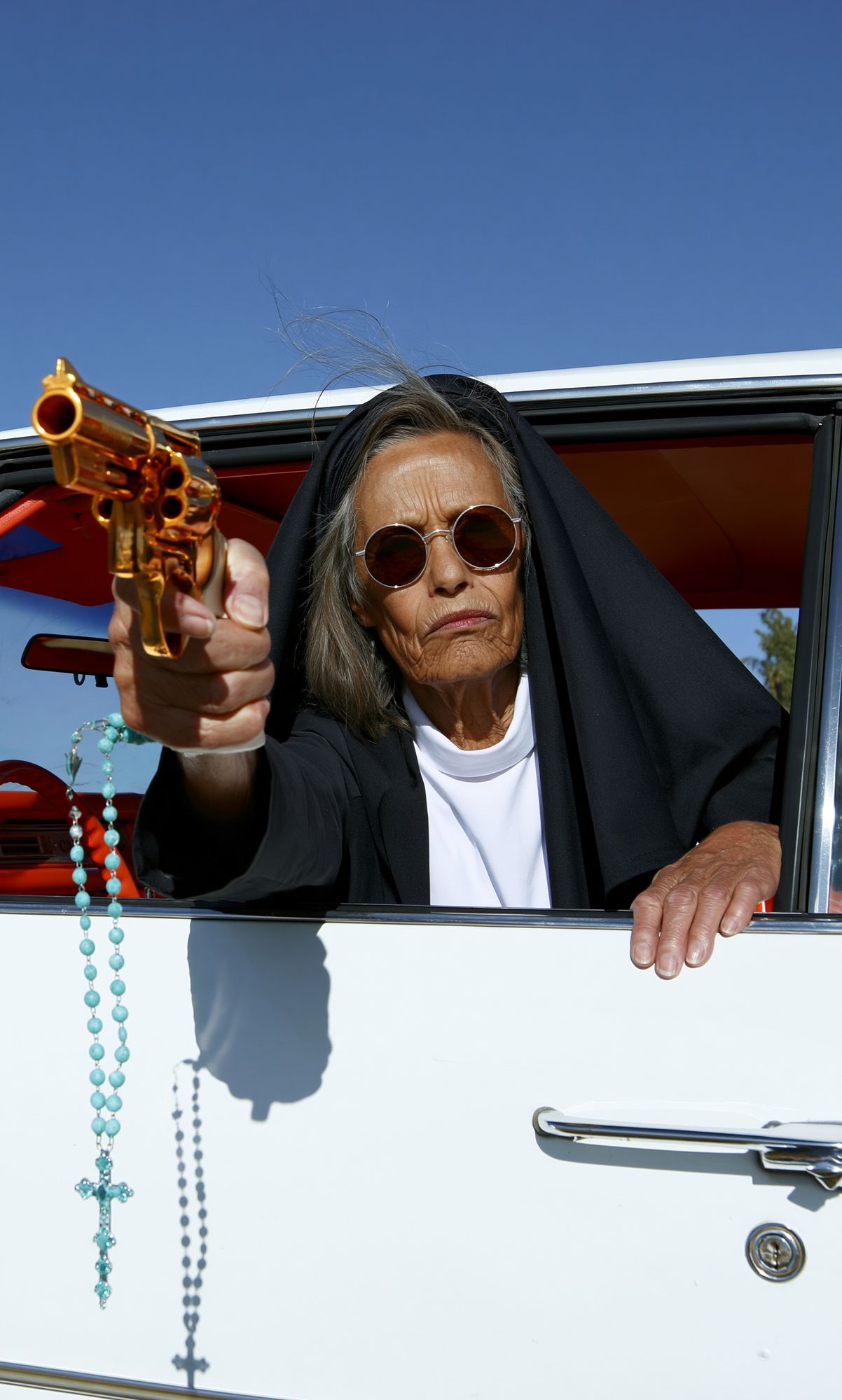Nun with Revolver Photography Poster. poster detail