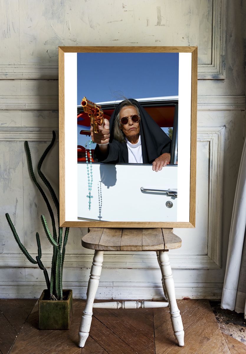 Nun with Revolver Photography Poster. room preview