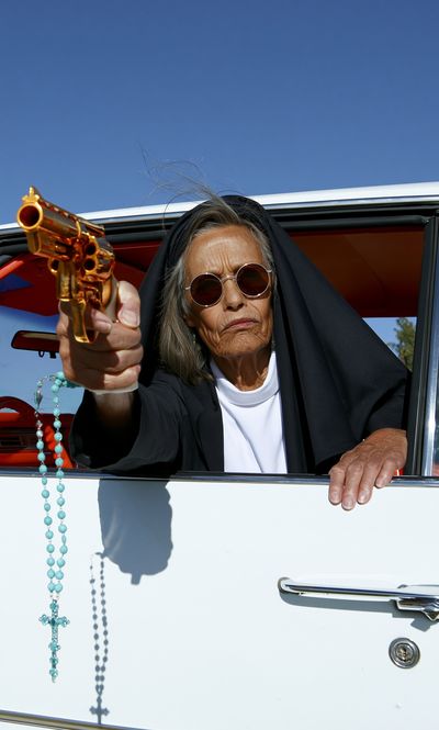Nun with Revolver Photography Poster. poster