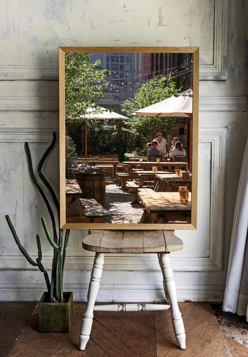 Sunlit Courtyard Cafe Photography Poster. room preview