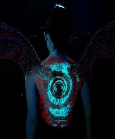 Neon Winged Figure Photography Poster.