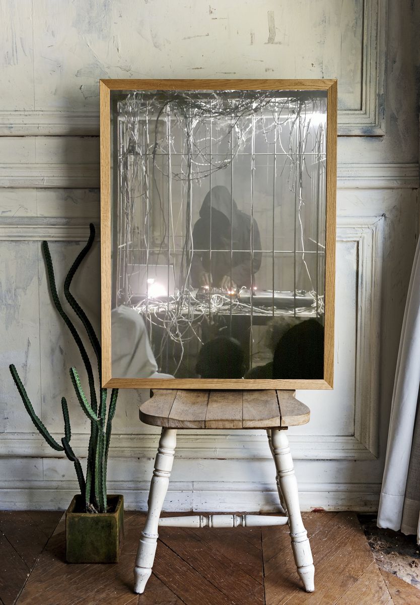 Hooded Figure in Wire Cage Poster. room preview