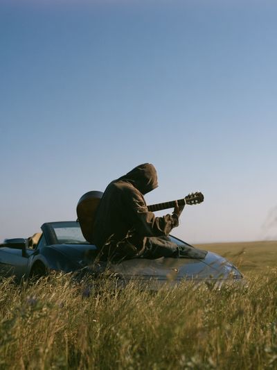 Guitarist in Field Photography Poster. poster