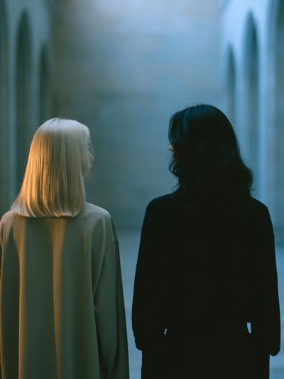 Two Figures in Blue Corridor Poster.