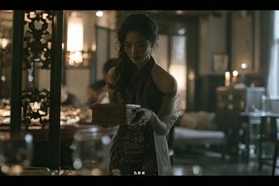 Cinematic Woman in Dim Interior Poster.