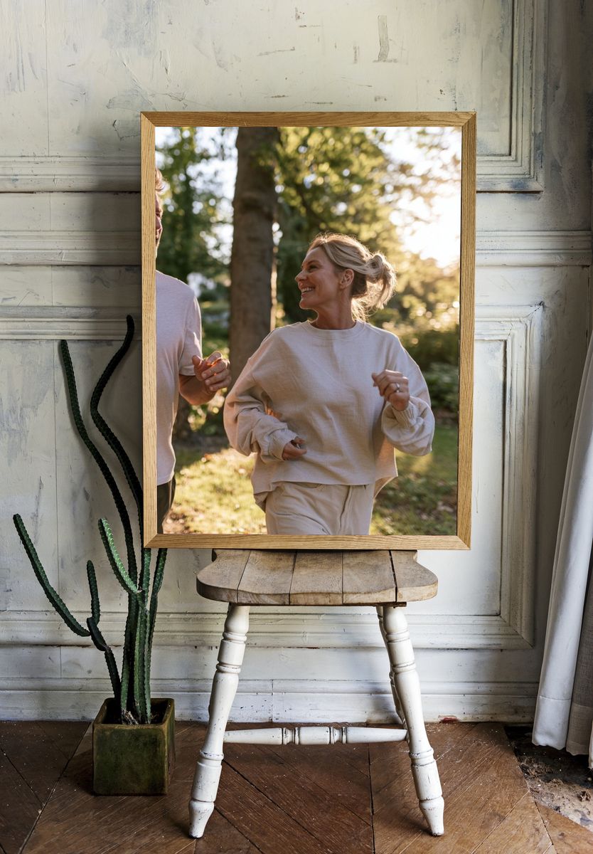 Couple Jogging in Sunlit Forest Photography Poster. — room view 1