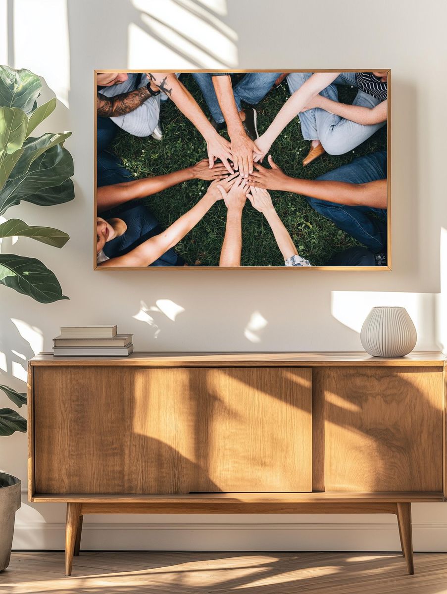 People stacking hands together park. — room view 3
