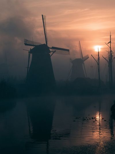 Misty Windmills at Sunset Poster. poster print