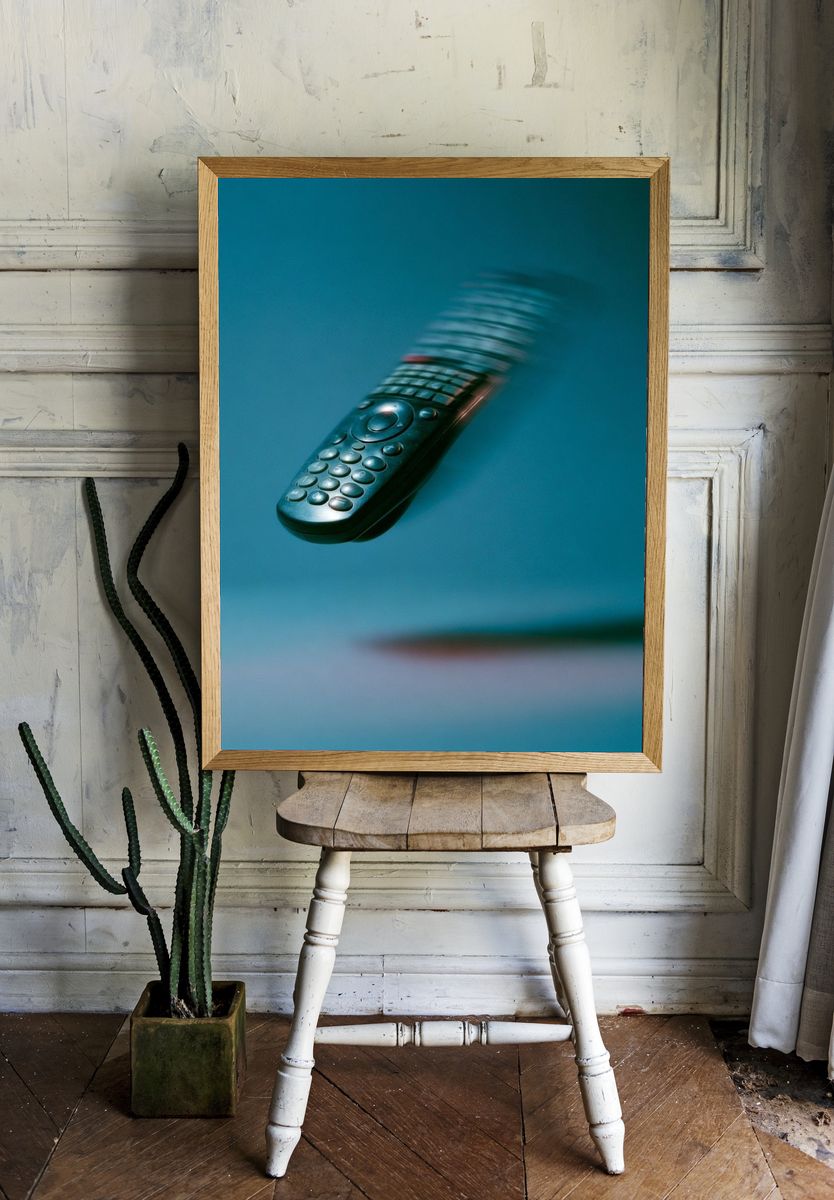 Floating Remote Control Photography Poster. — room view 1