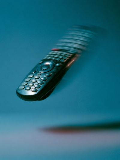 Floating Remote Control Photography Poster. poster