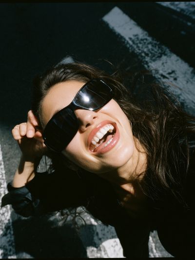Smiling Woman in Sunglasses Photography Poster.