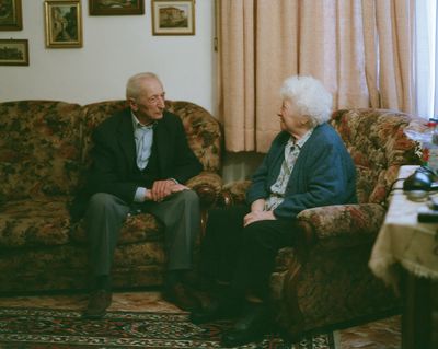 Elderly Couple in Living Room Photography Poster. poster