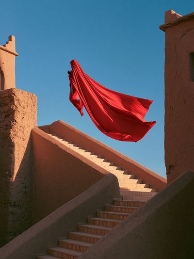 Red Cloak Stairway Photography Poster.