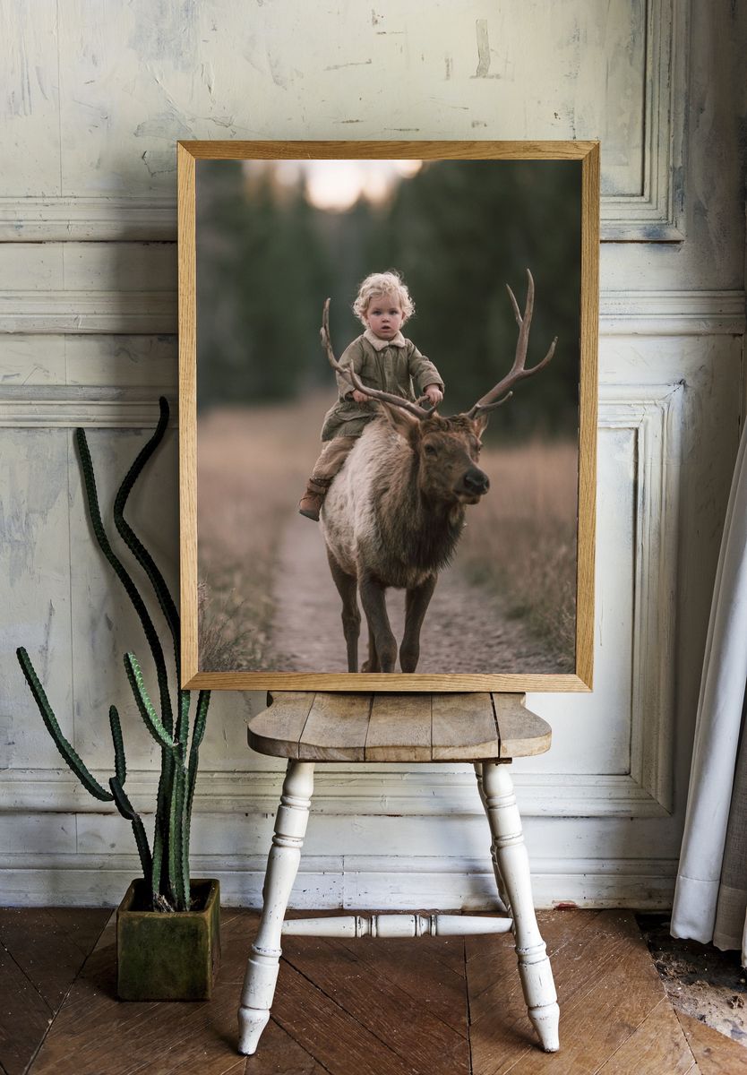 Child Riding Elk Photography Poster. — room view 1