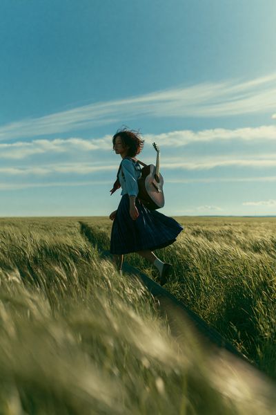 Girl with Guitar in Wheat Field Poster.